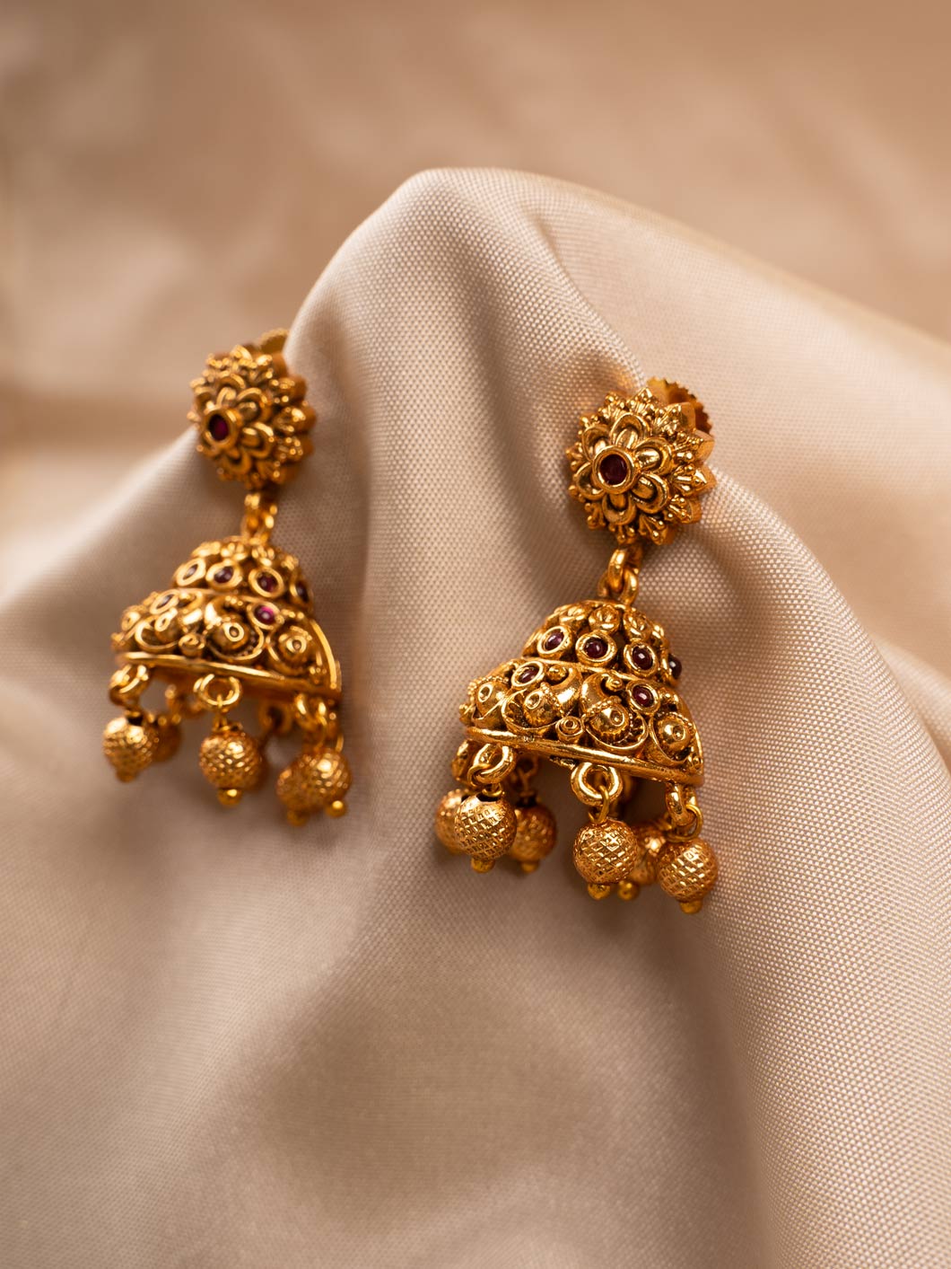 Unique Gold Jhumka Earrings with Contemporary Design